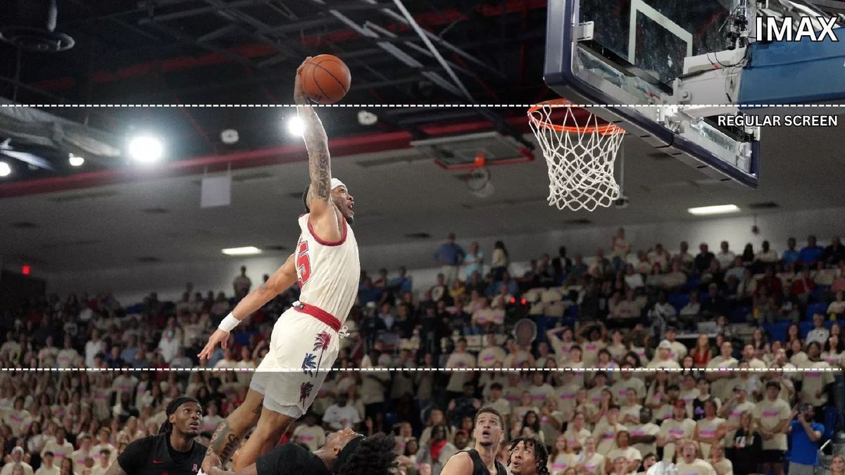 Basketball dunk in front of a packed crowd